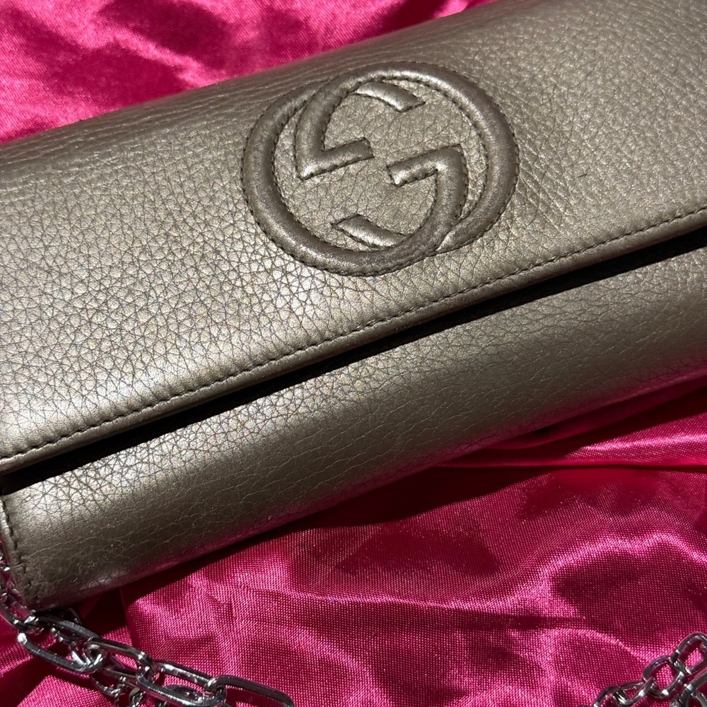 Gucci Silver Clutch with Embossed Logo